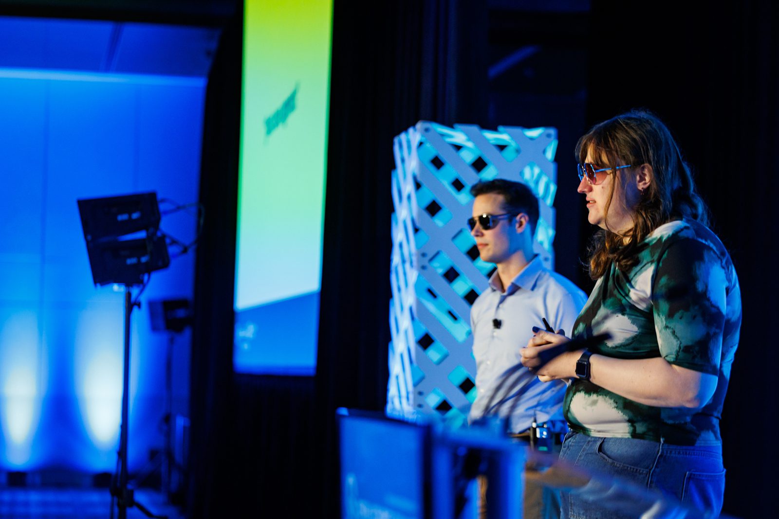 Two speakers on stage during a Valkey conference talk