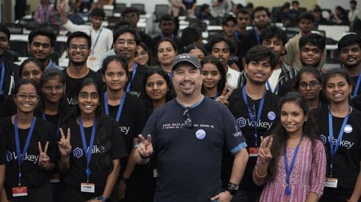 Student contributors wearing Valkey shirts at a community event